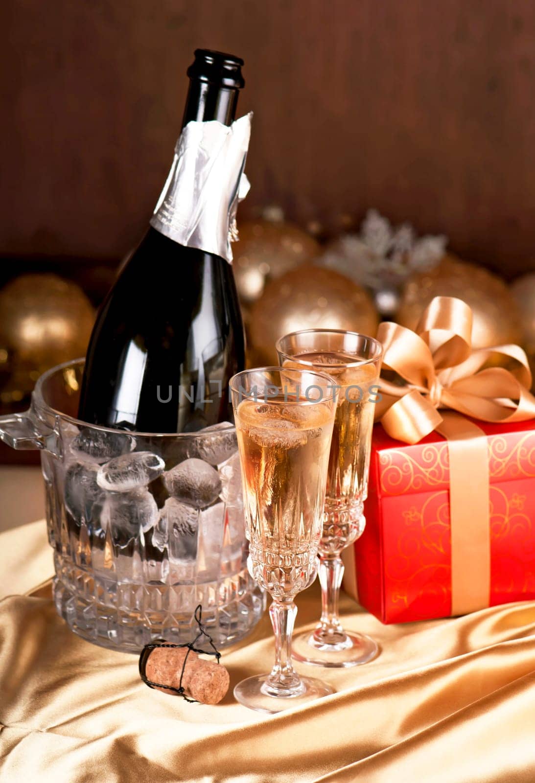 Still life, romantic dinner, two glasses and champagne in the ice bucket. Celebration or holiday