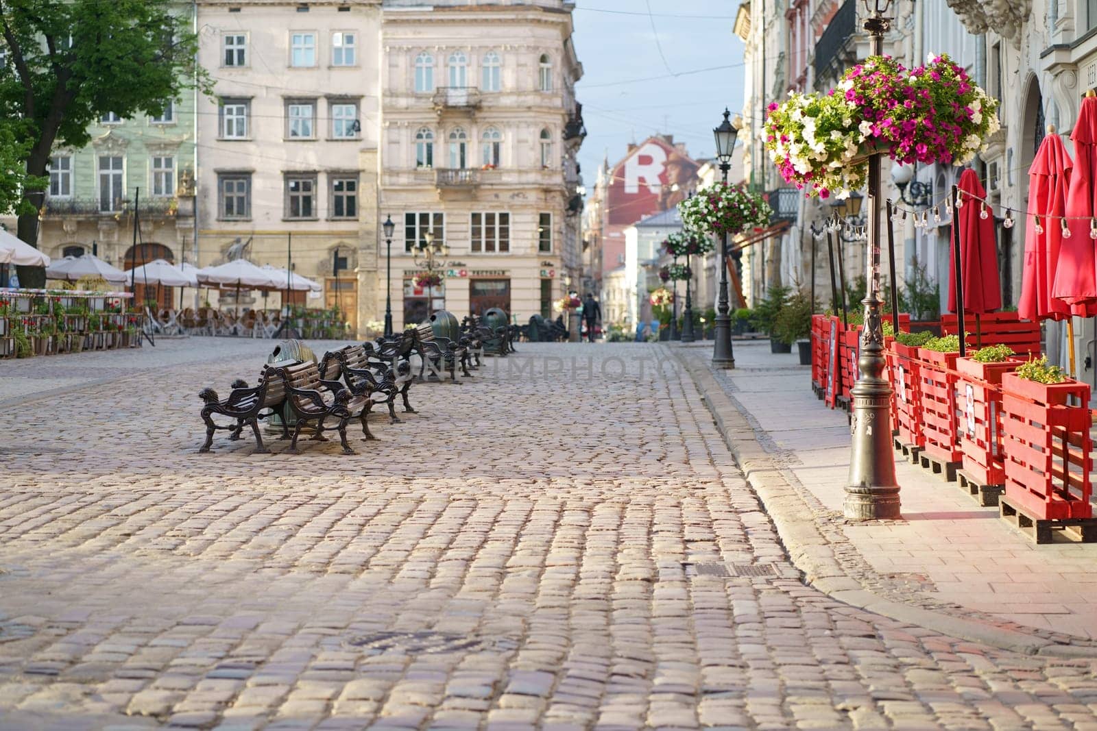 Lviv, Ukraine - 2021. May. View of the city streets of Lviv. Cityscape of the old town with beautiful buildings in the early morning at sunrise. Summer trip to Ukraine. by aprilphoto