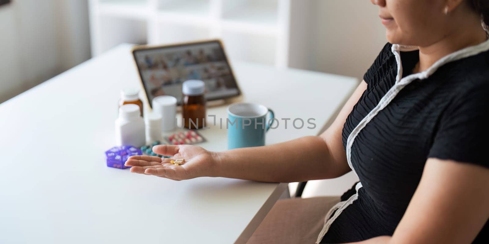 Women organize check the medicine bottle her medication into pill dispenser. female taking pills from box. Healthcare and concept with medicines. medicaments on table by nateemee