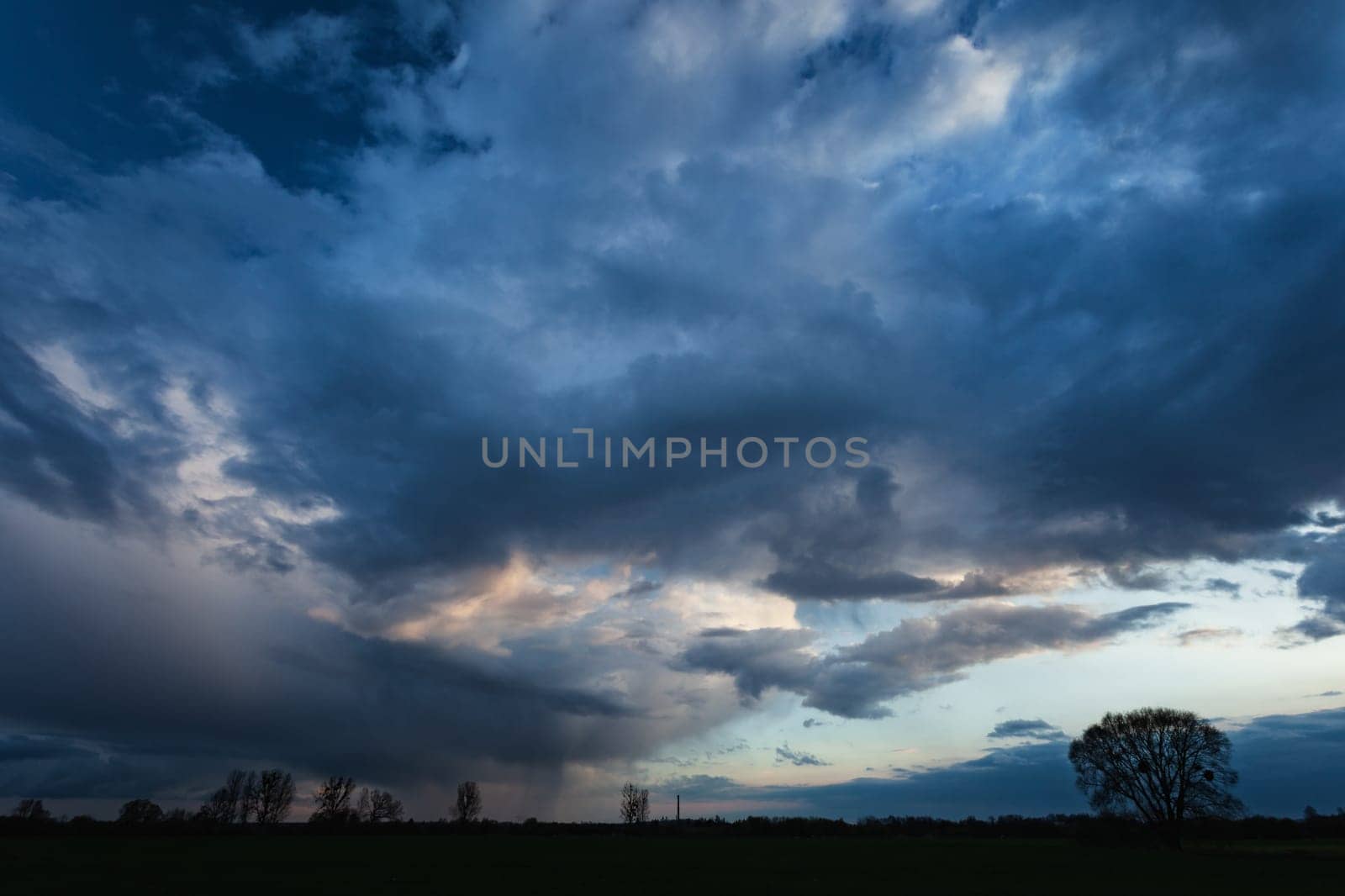 Sky landscape with dynamic clouds, spring evening, eastern Poland