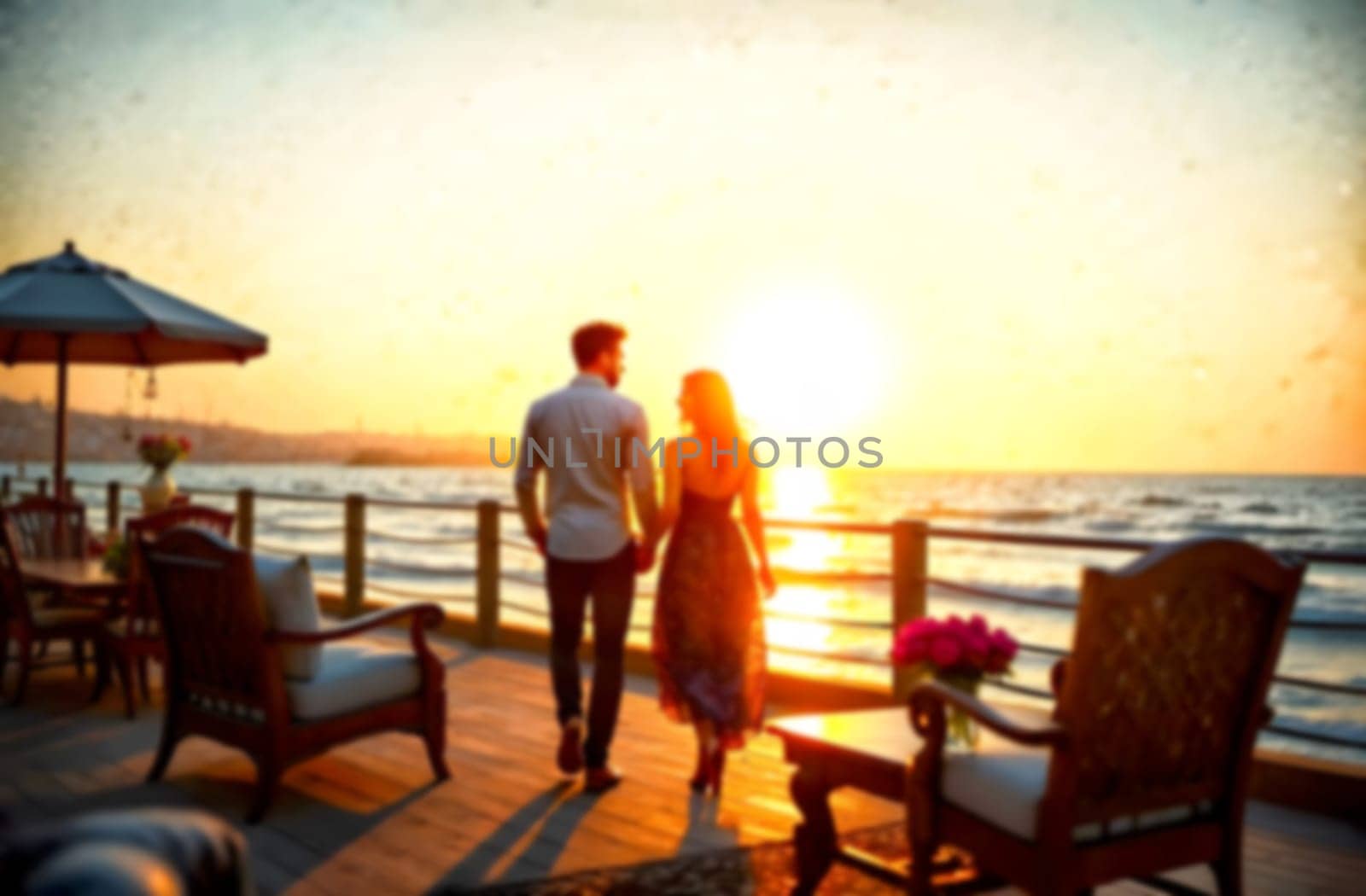 A couple walks hand in hand on a seaside deck while the sun sets, creating a romantic atmosphere perfect for Valentine's Day.. Blurred picture