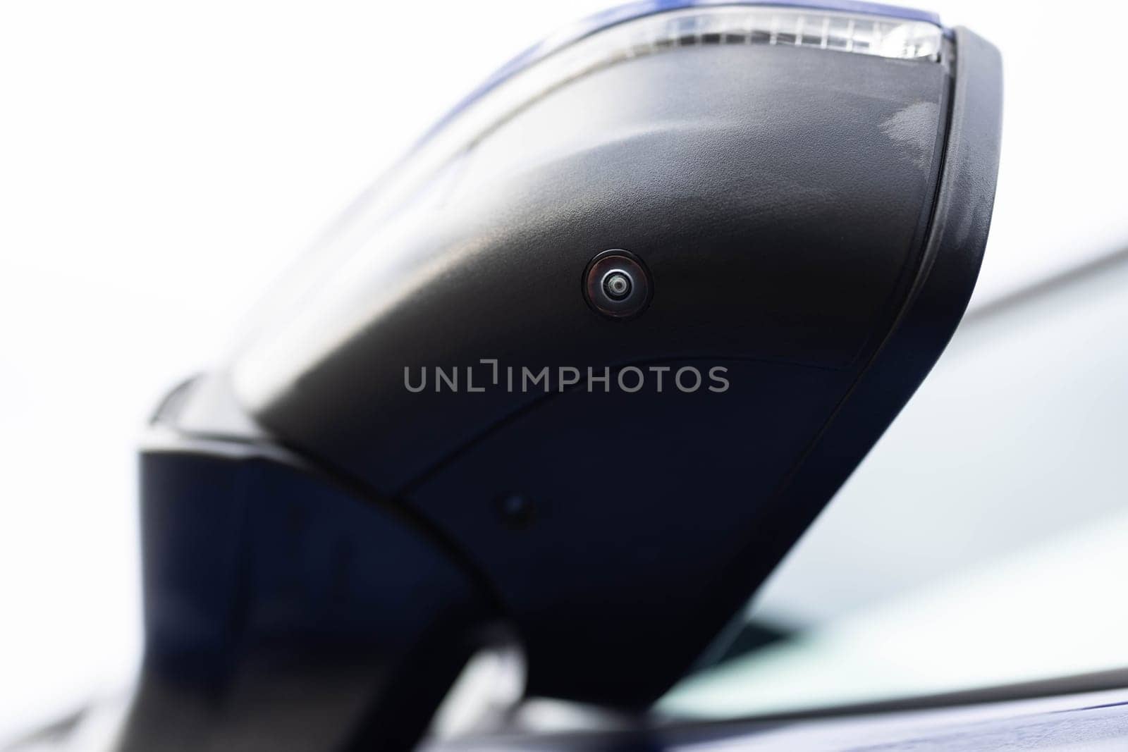 Surround view camera system in modern car. Camera lens underneath side mirror blind spot camera system. Parking assist systems. Surround View 360 Degrees Reverse Camera Front camera.