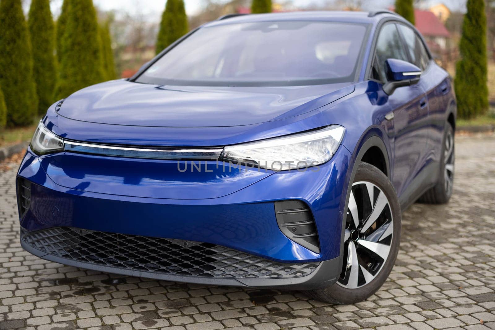 Modern subcompact electric crossover car SUV. Exterior details. Large size wheels. Exterior of fully electric suv car. Car for sale and rent business concept. Electric automobile.