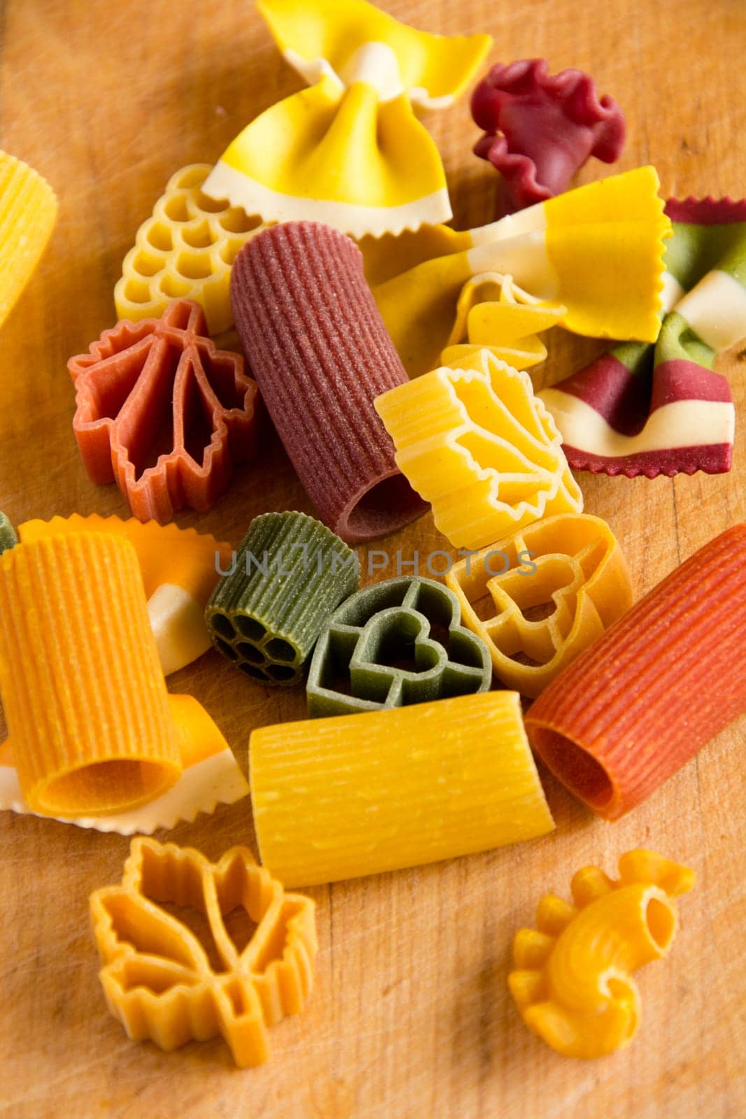 Multicolored italian pasta, vertical background