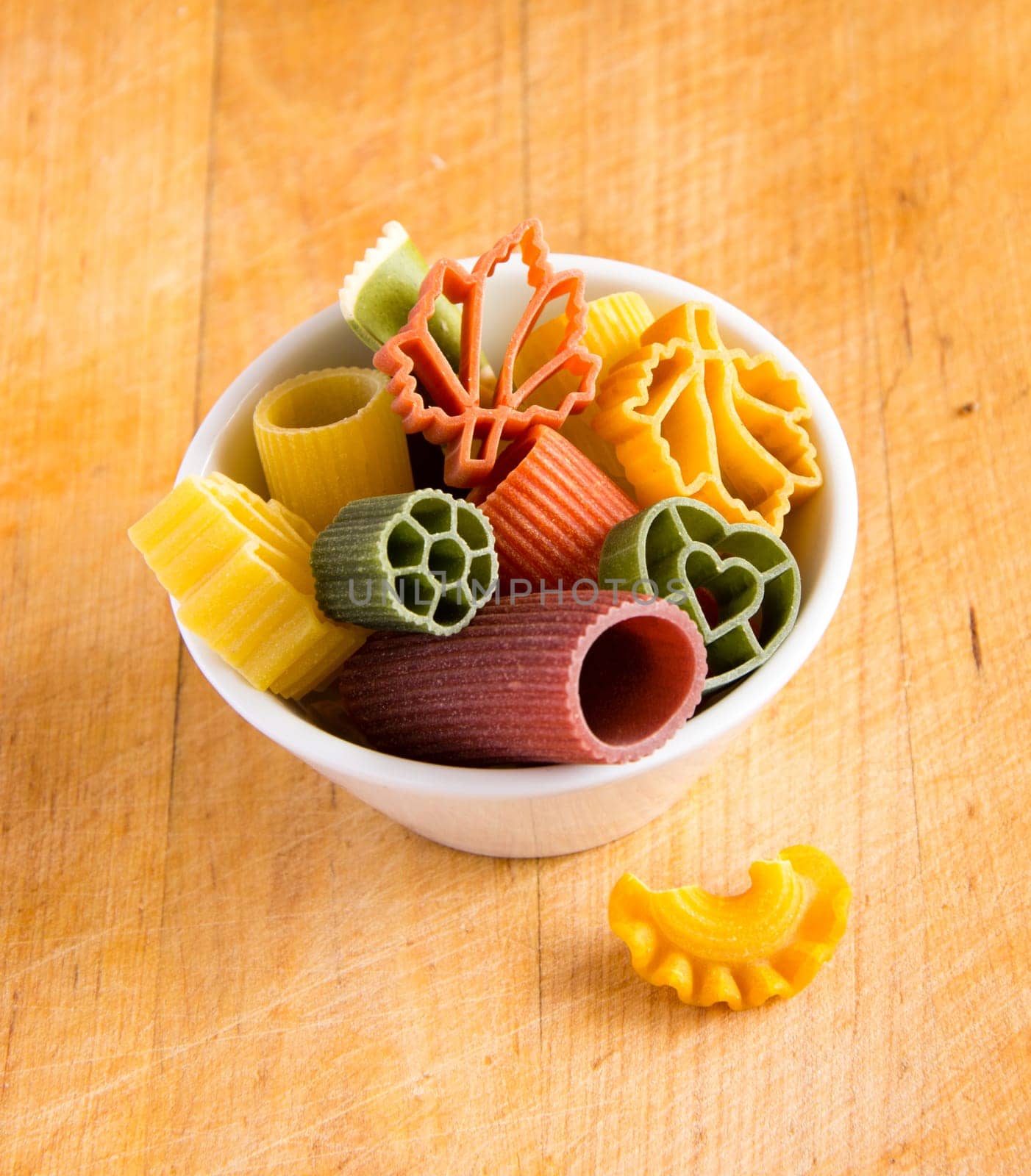 Multicolored italian pasta in bowl
