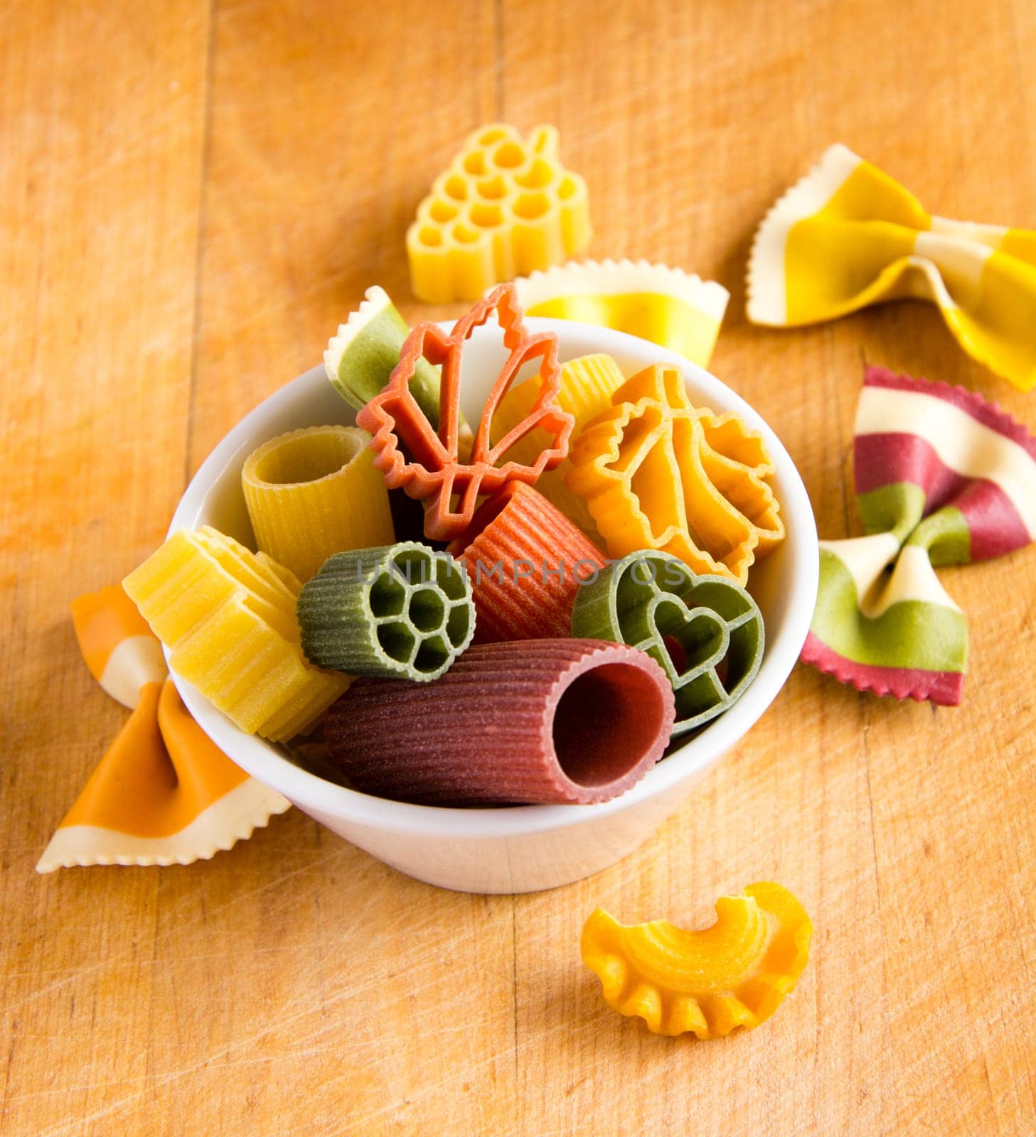Multicolored italian pasta in bowl