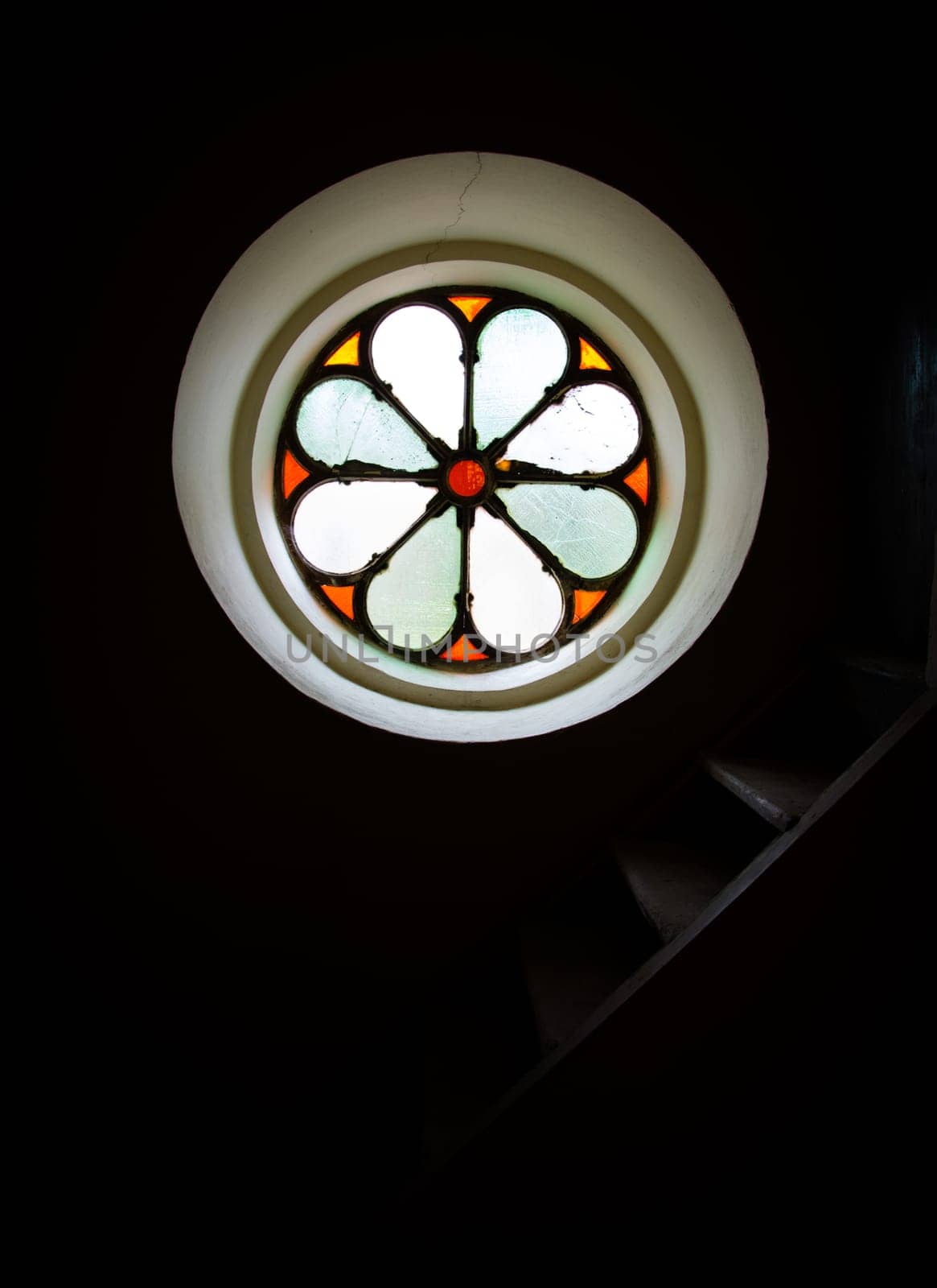 Lights come through the stained glass window