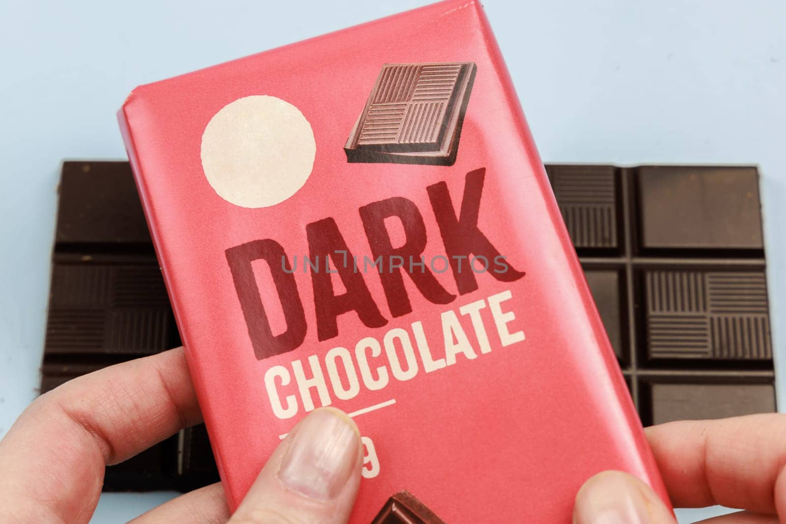 Delicious dark chocolate bar with the inscription Dark Chocolate. Healthy eating concept. High quality photo