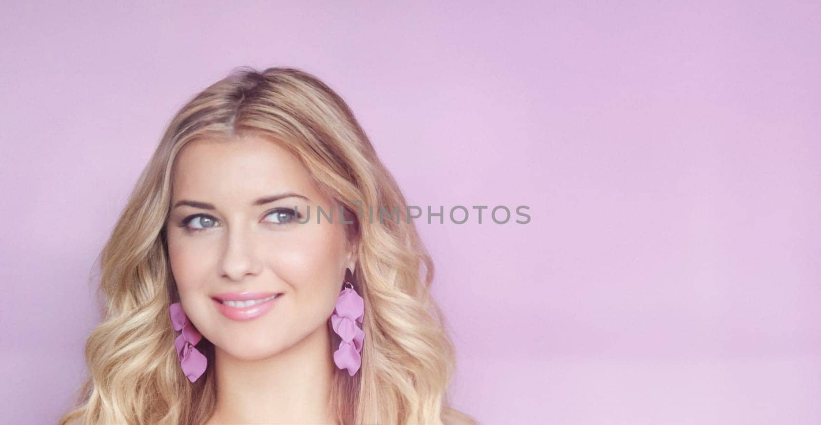 Blonde woman with soft curls and radiant purple earrings, set against a gentle lilac background. Her serene expression and soft smile evoke elegance and grace look