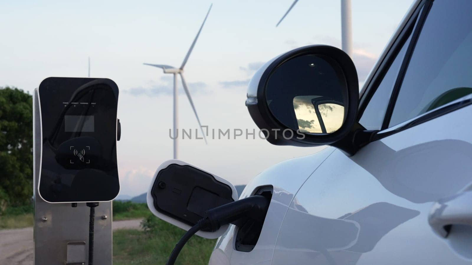 Progressive combination of EV car, charging station and wind turbine. by biancoblue