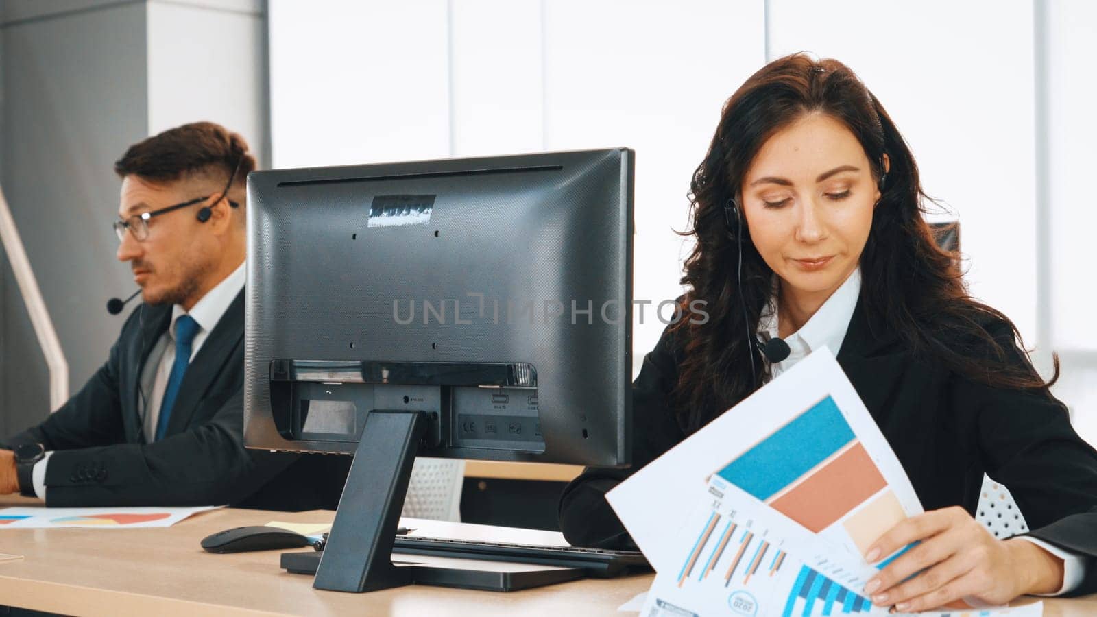 Business people wearing headset working in office Jivy by biancoblue