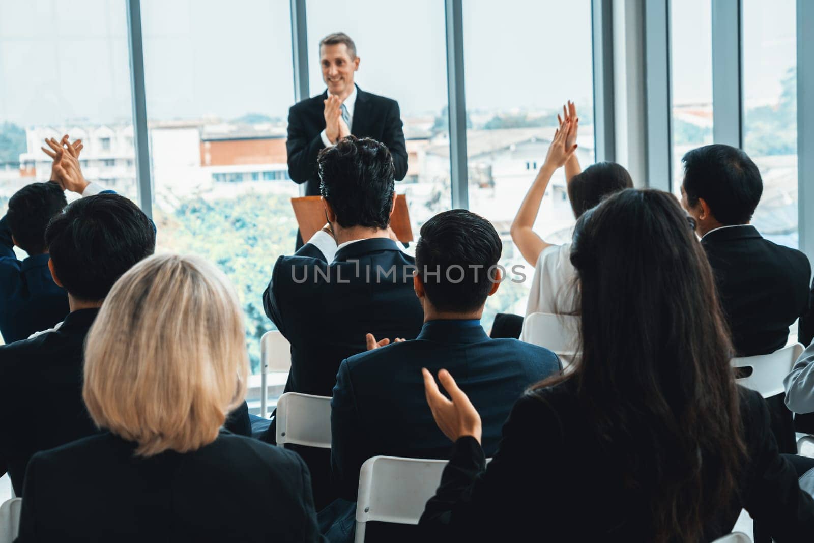 Group of business people meeting in a seminar conference Jivy by biancoblue
