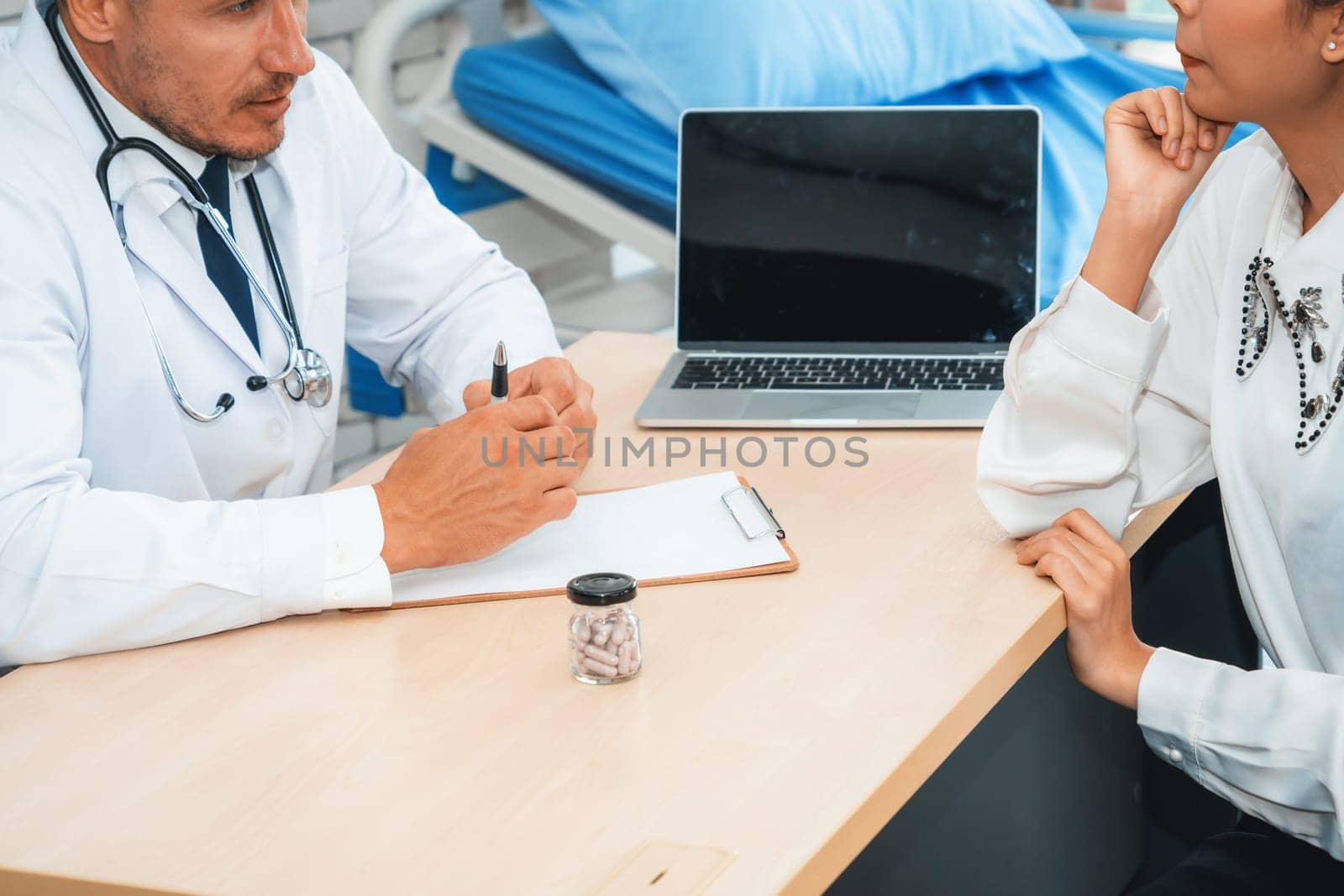 Doctor in professional uniform examining patient at hospital or medical clinic. Health care , medical and doctor staff service concept. Jivy