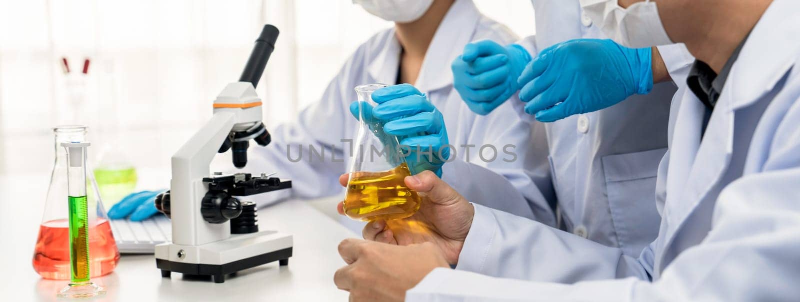 Laboratory researcher team advance healthcare with scientific expertise and laboratory equipment, researching new medicines and developing cure in the lab. Panorama Rigid