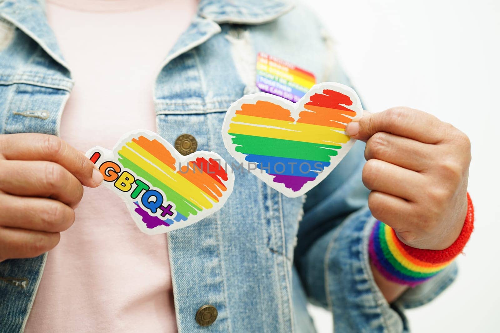 Asian woman with rainbow flag, LGBT symbol rights and gender equality, LGBT Pride Month in June.