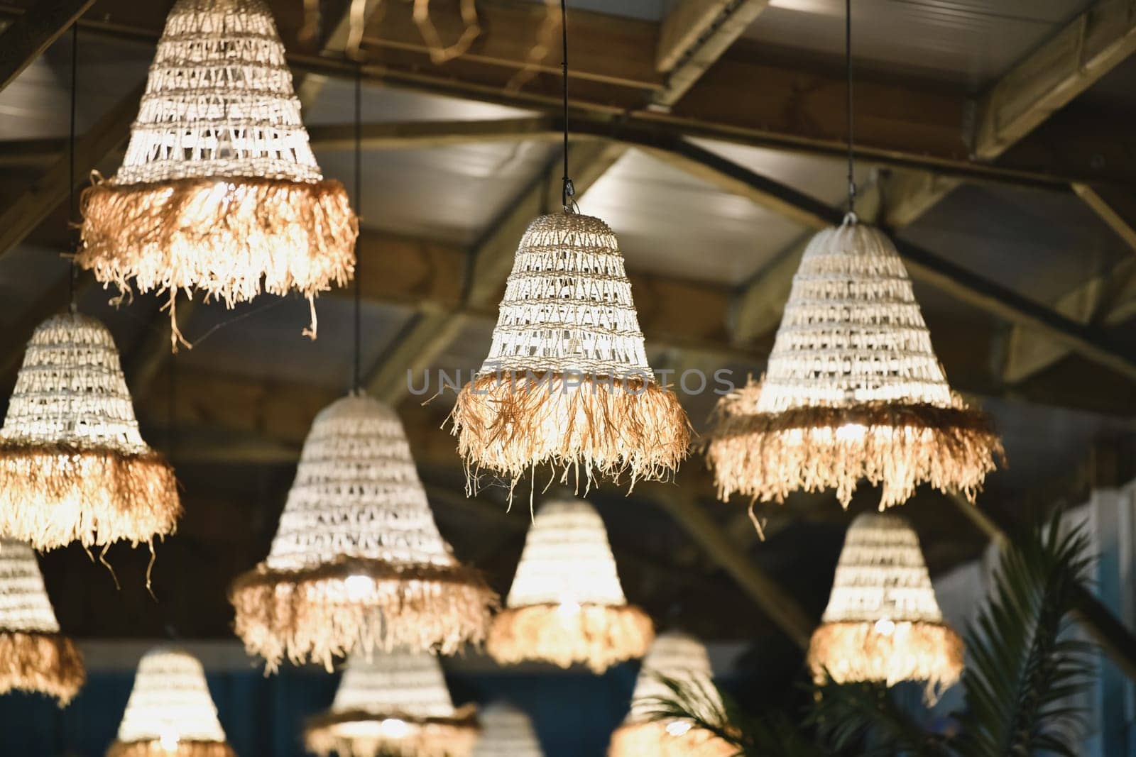 Wicker lamps hanging at the ceiling
