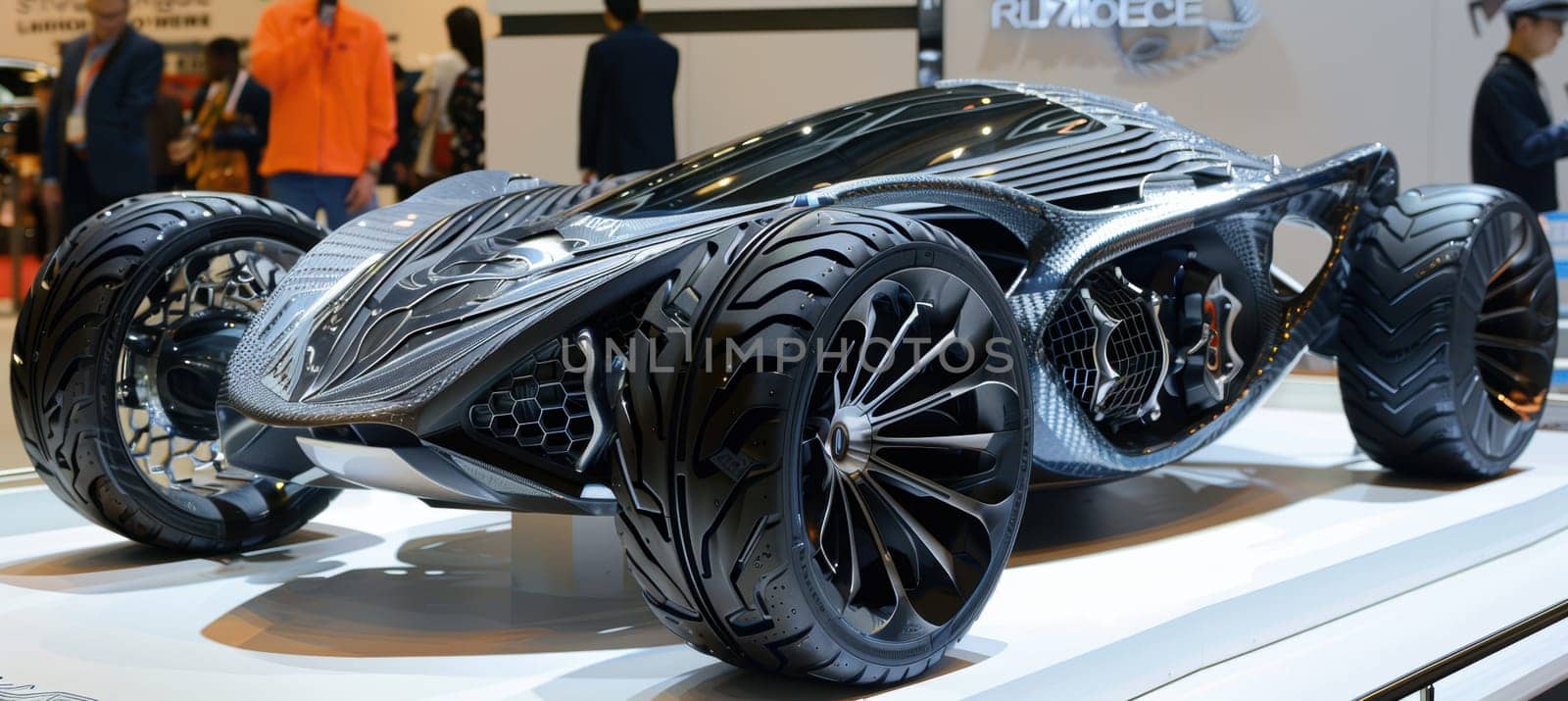 A sleek futuristic concept car showcased at an auto show emphasizes cutting-edge technology. notable for its innovative tire designs with unique patterns and materials, advancements in automotive aesthetics and functionality.