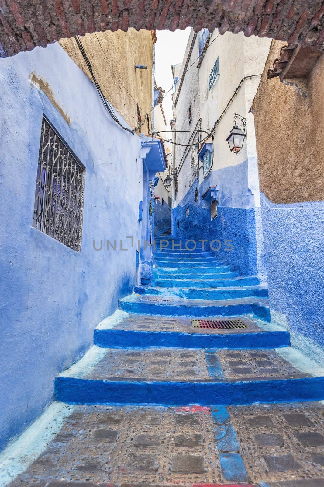 Empty staircase in a blue city of Chefchaouen. Morocco. Vertically. 