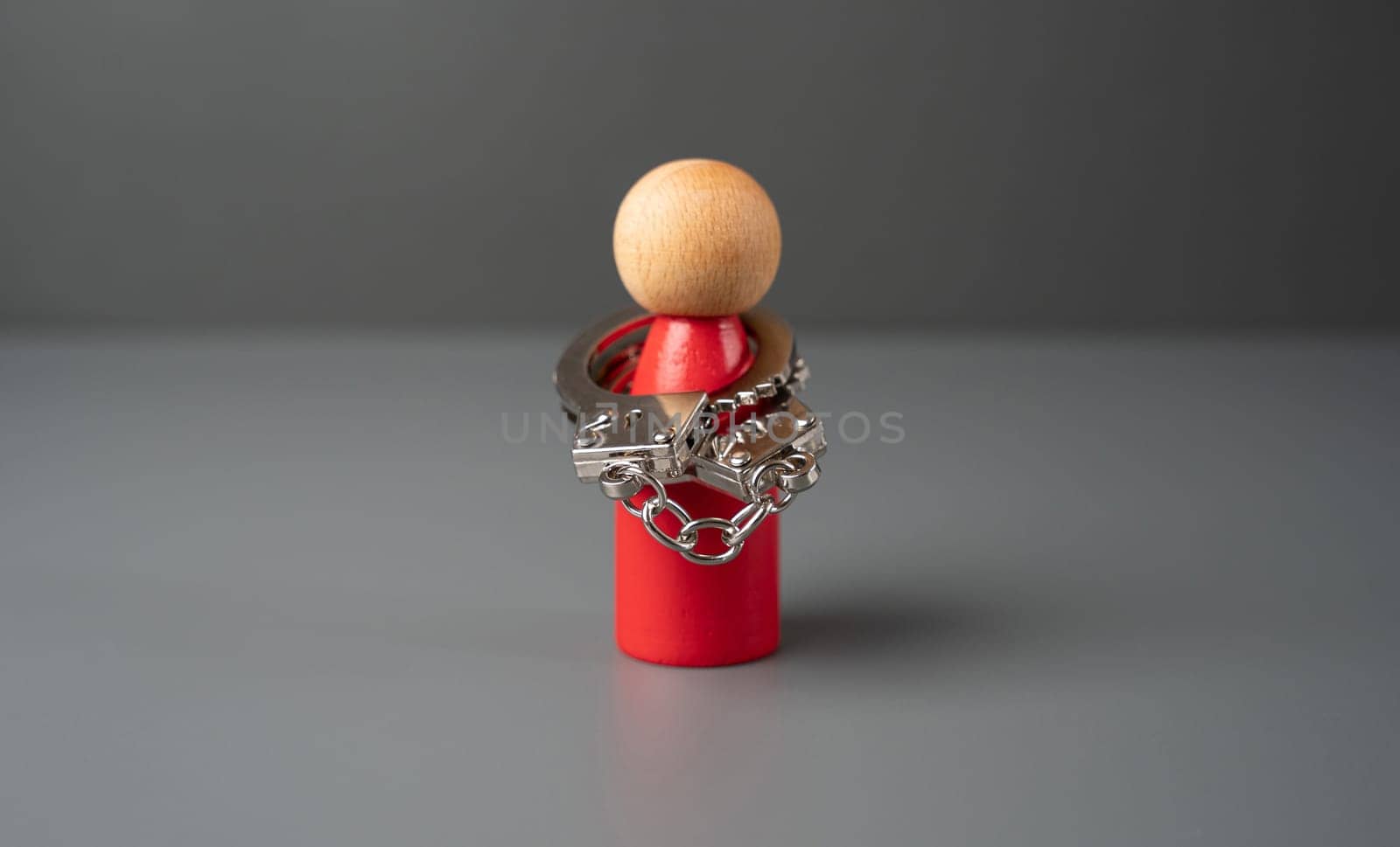 A man handcuffed to himself. The concept of complexes and stiffness. Shyness. High risk of mental breakdown. Depression and frustration. Censure, psychological abuse. Get outside the box.