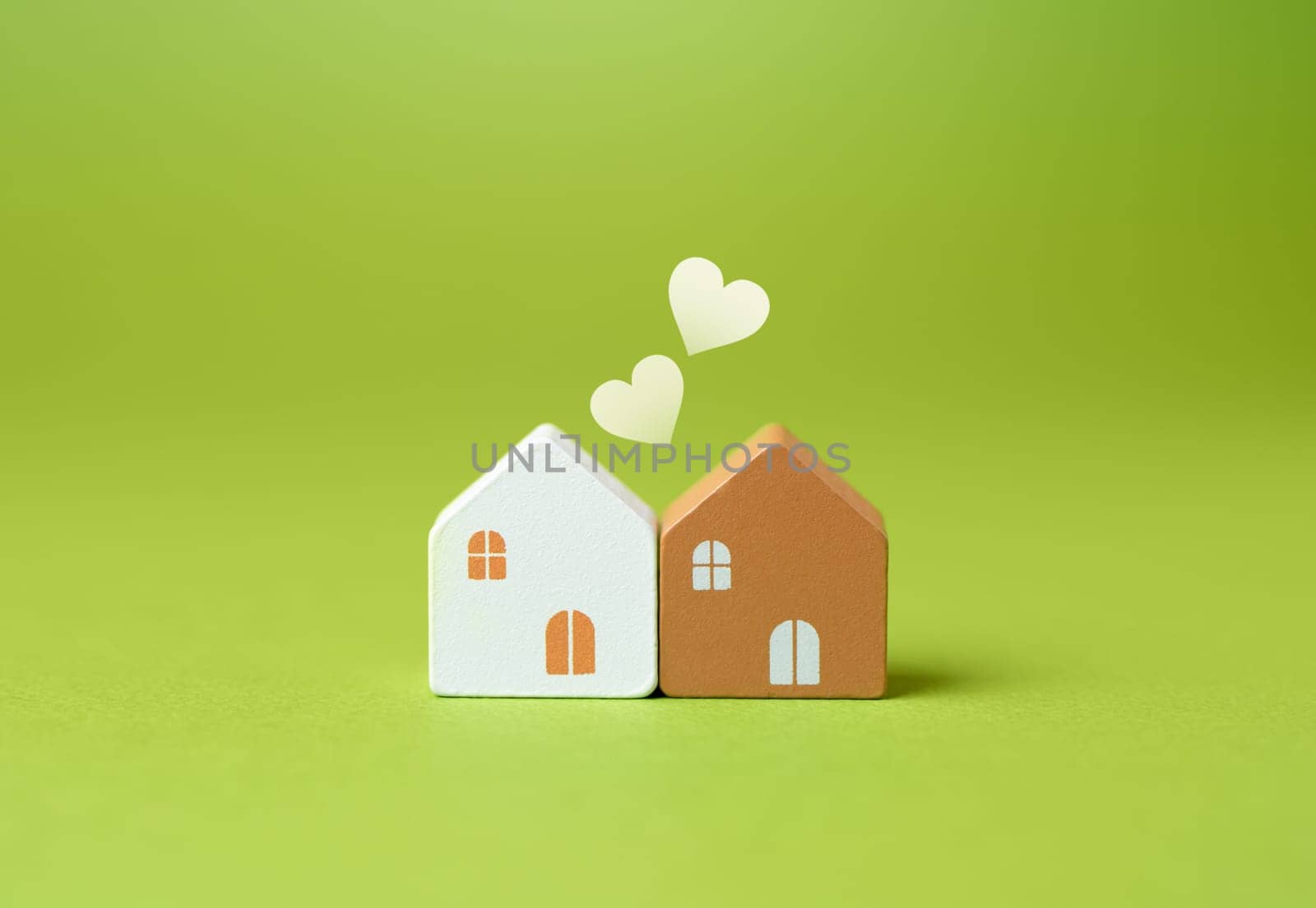 Two houses and hearts. Love and relationships concept. Purchase joint real estate.