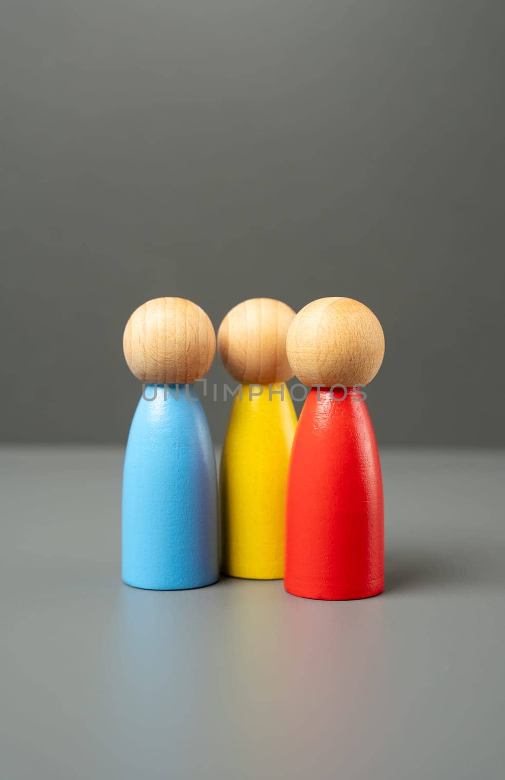 Three human figures. Communication and talking. Friendly relations. People representing different groups, communities and cultures. Friendship and relationships. Mediation.