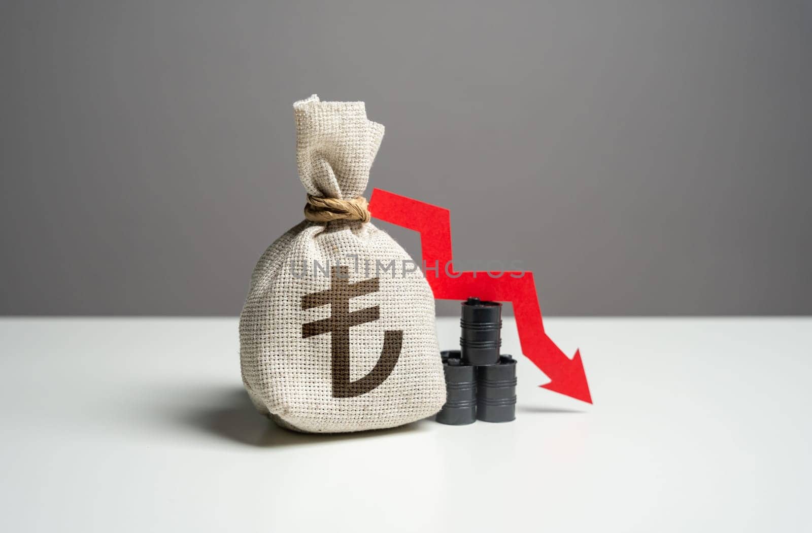 Oil barrels and turkish lira money bag and red arrow down. Falling profit from the sale of energy resources and petroleum products. Trade and fall of oil transportation. Negative prognosis
