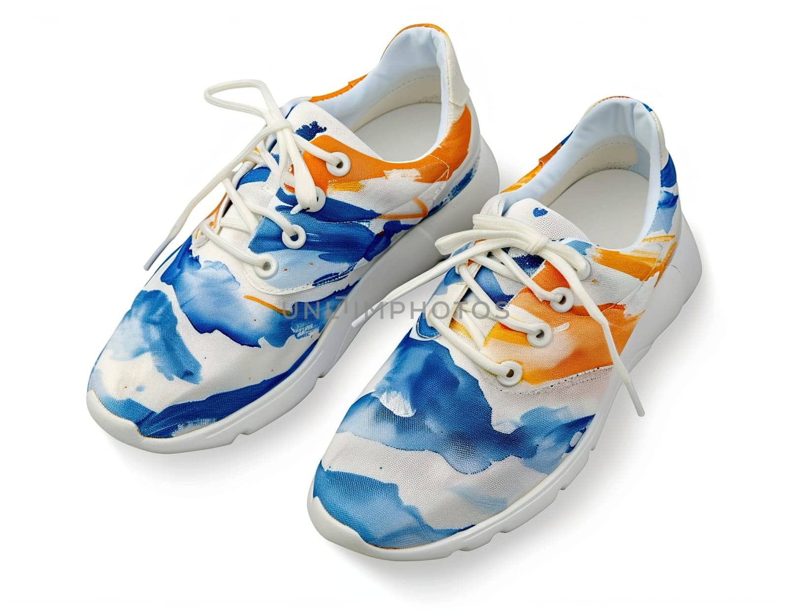 Pair of hand-painted sneakers with vibrant abstract designs, isolated on white background.