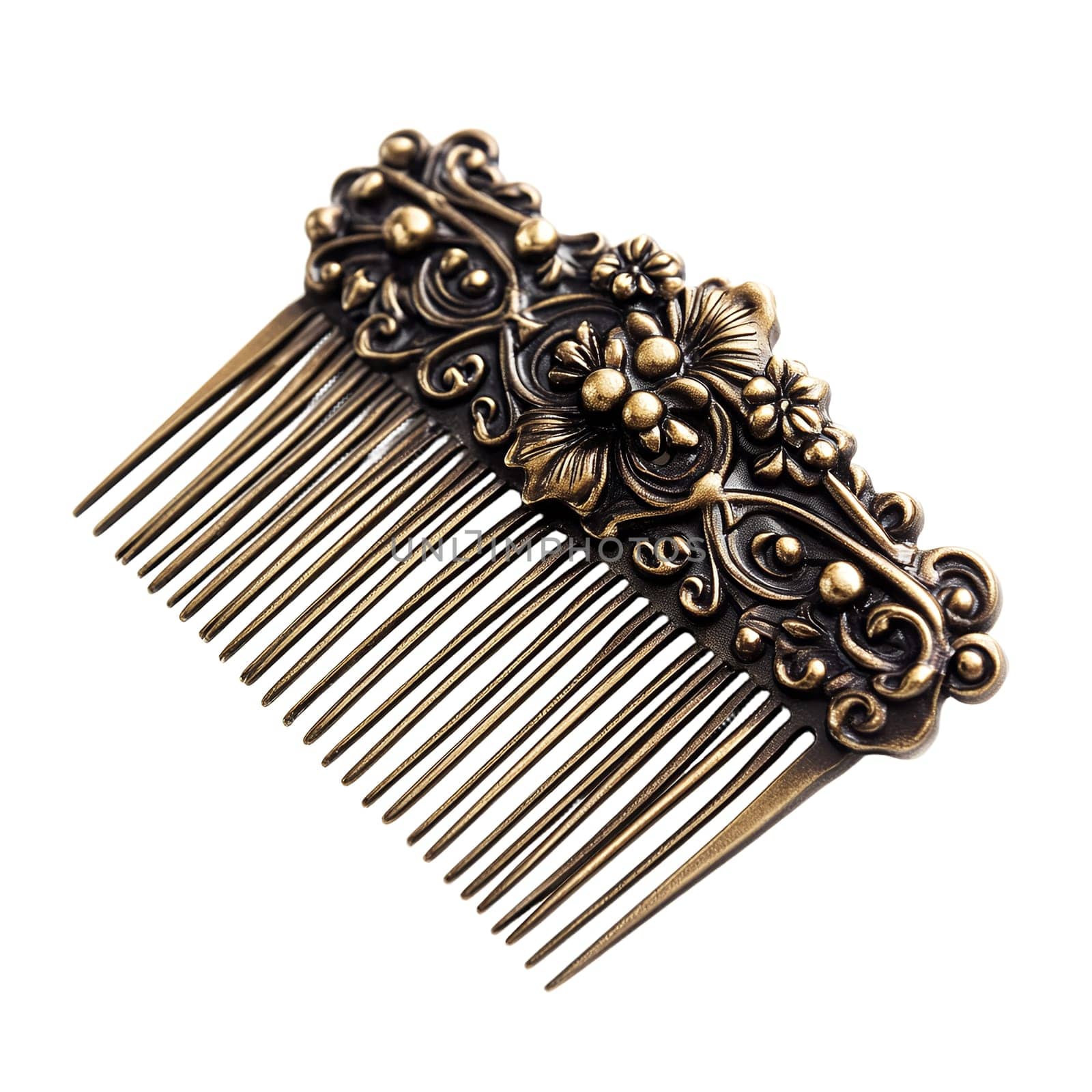 Antique ornate gold-colored hair comb with floral design isolated on white background.