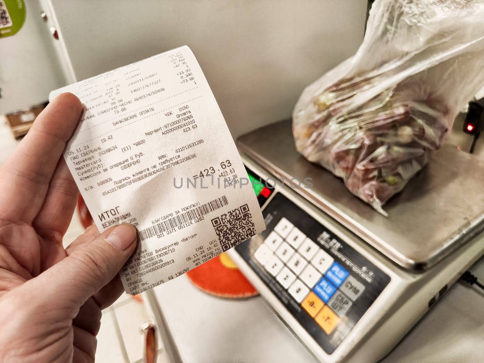 Ulan-Ude, Russia - November 05, 2024: A cash register receipt displays a variety of products purchased in Ulan-Ude, Russia indicating the total price paid.