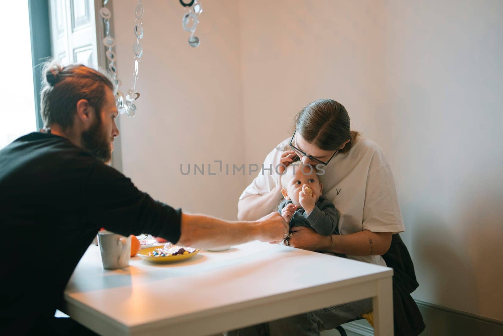 A family is happily enjoying breakfast together, creating cherished memories in the comfort of their home