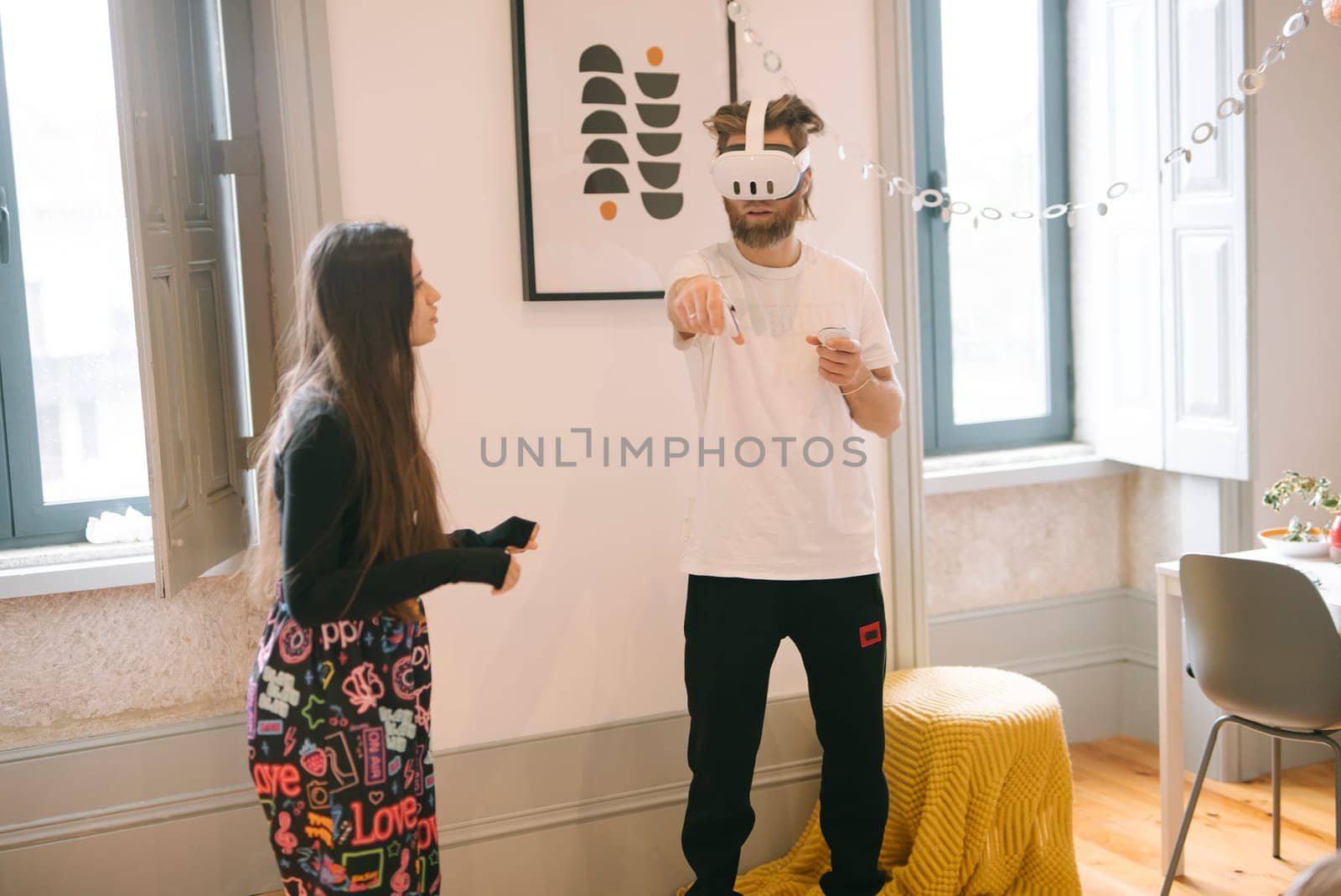 An engaging and playful moment unfolds between two individuals within a lively, contemporary, and vibrant setting