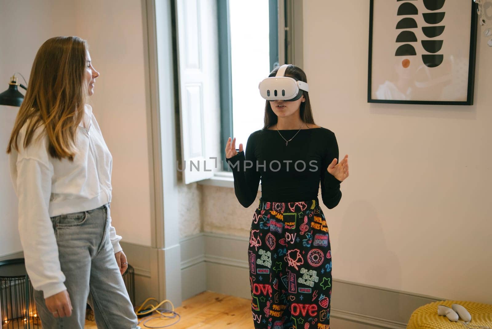 A girl enjoys a VR experience while an observer highlights modern technology and creative expression today
