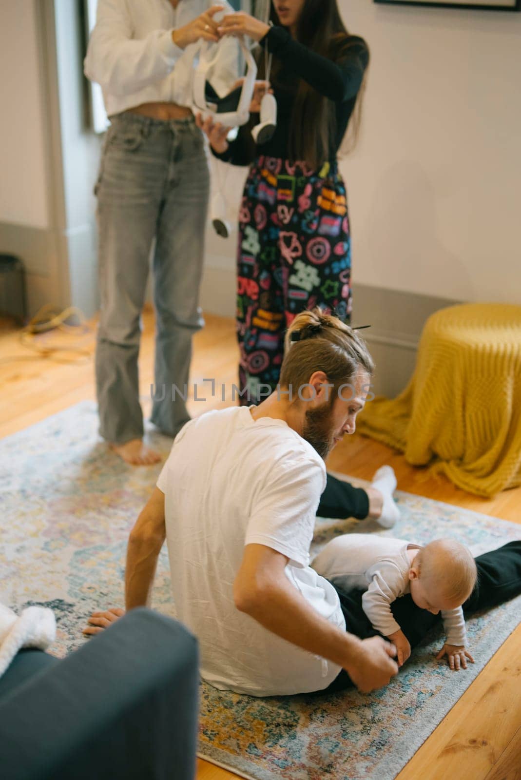 Capturing a delightful and joyful family interaction featuring a baby in a warm, cozy, inviting home atmosphere