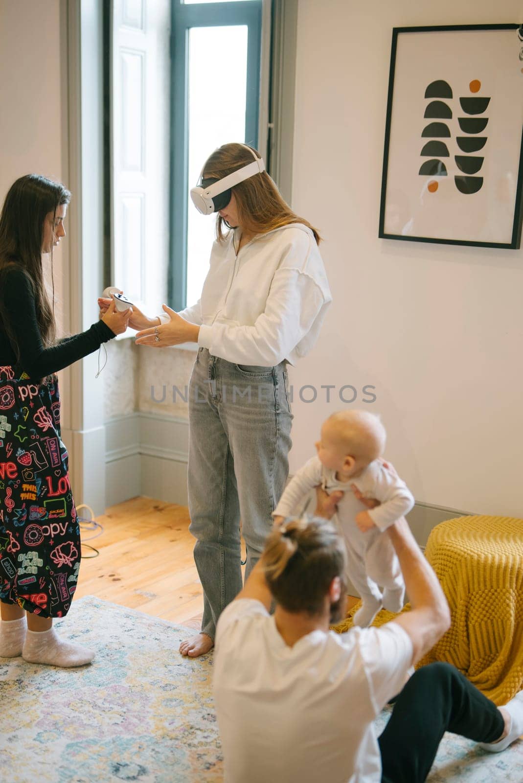 A family enjoys quality time together in virtual reality while caring for their stylishly designed baby