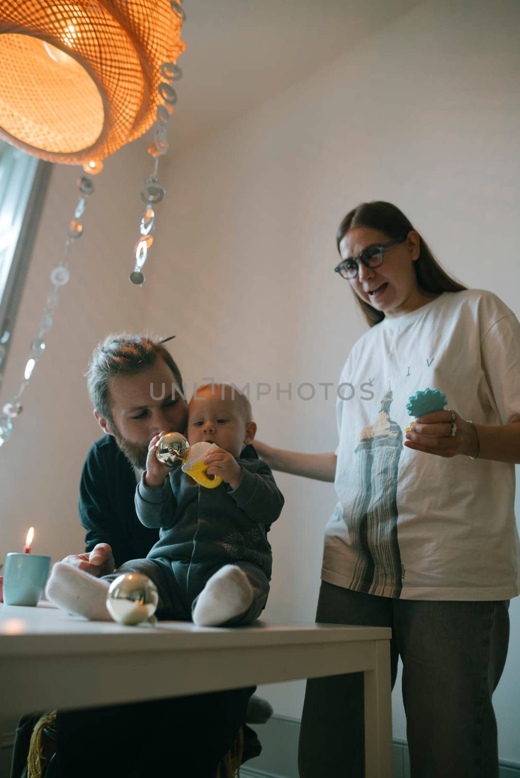 A wonderful family enjoys precious quality time together, showcasing love, laughter, and playfulness in a cozy setting