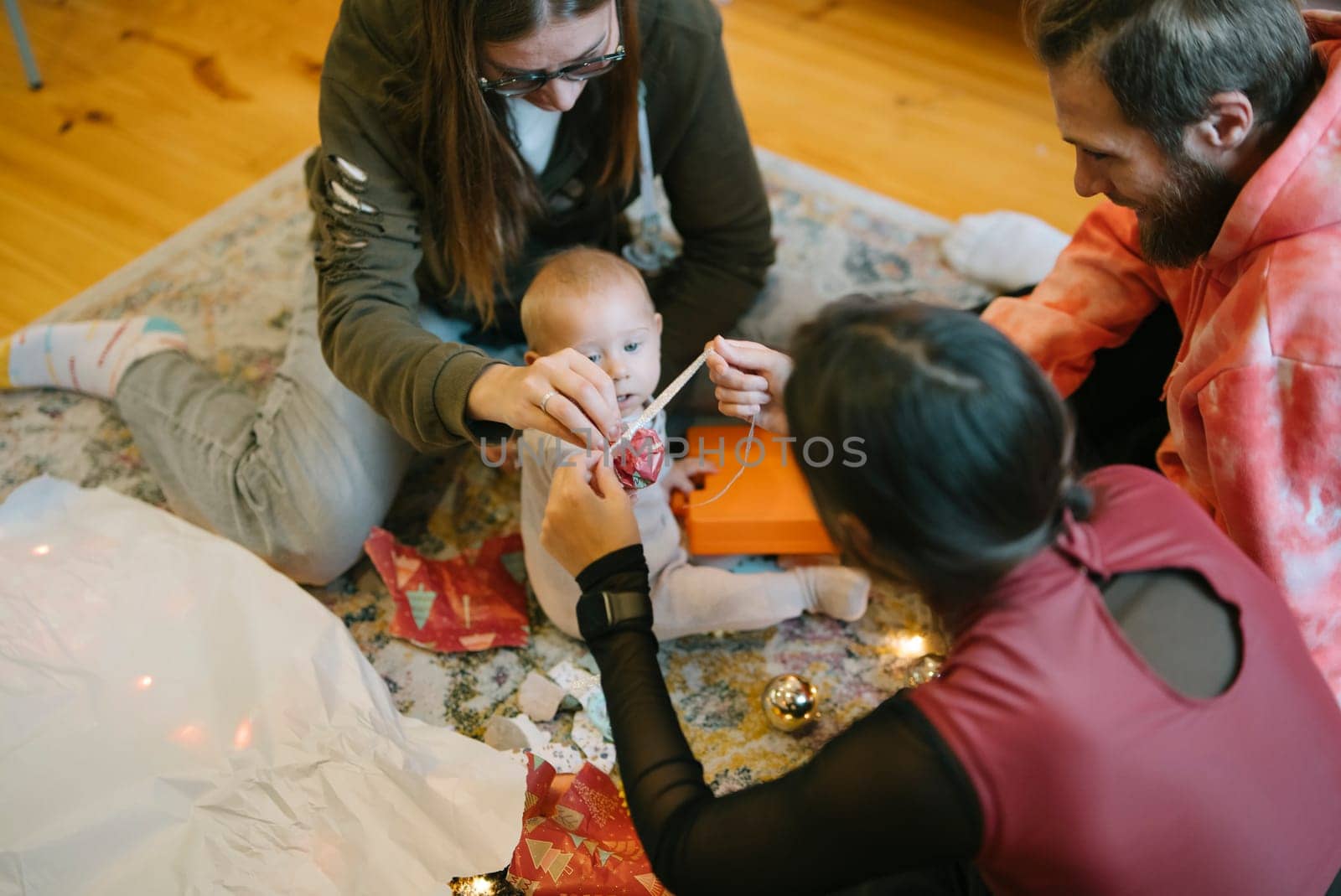 A happy and joyful family interaction with a baby, wonderfully creating festive memories together as one