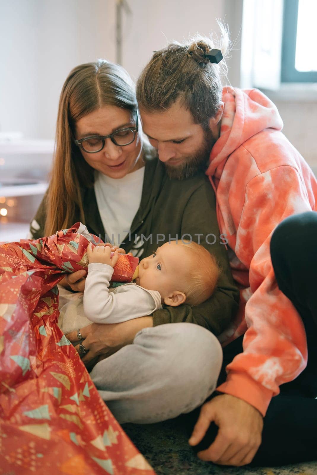 A heartfelt family moment of caring for a baby, showcasing deep love and emotional connection that warms the heart