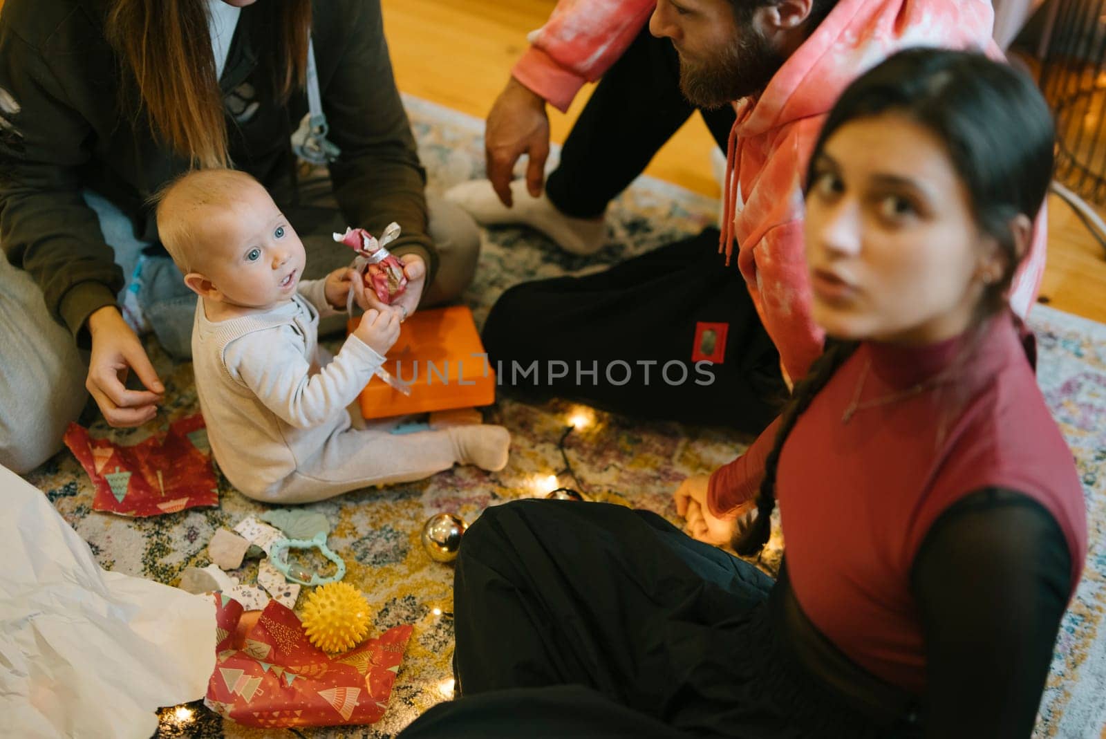 Enjoying a cozy family moment with a baby, surrounded by love, thoughtful gifts, and pure joy in a delightful setting