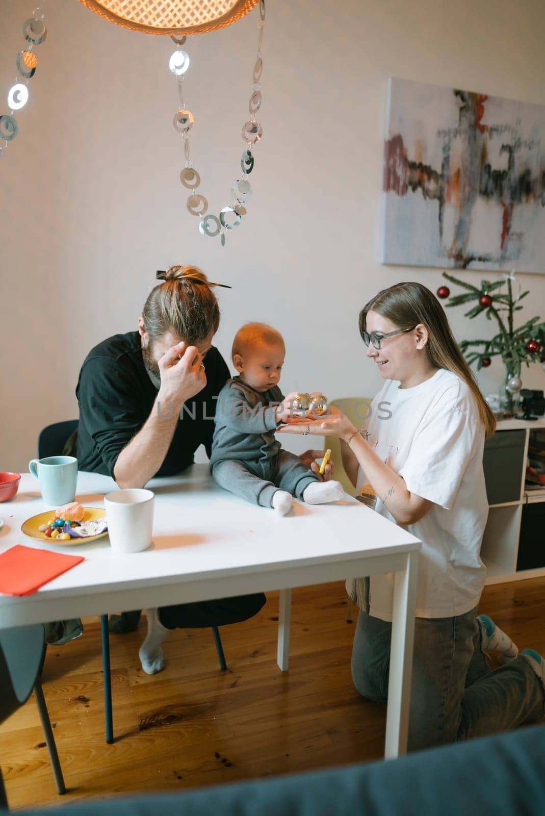 A warm and cozy family breakfast scene showcasing a loving parent, a cheerful toddler, and their playful interactions