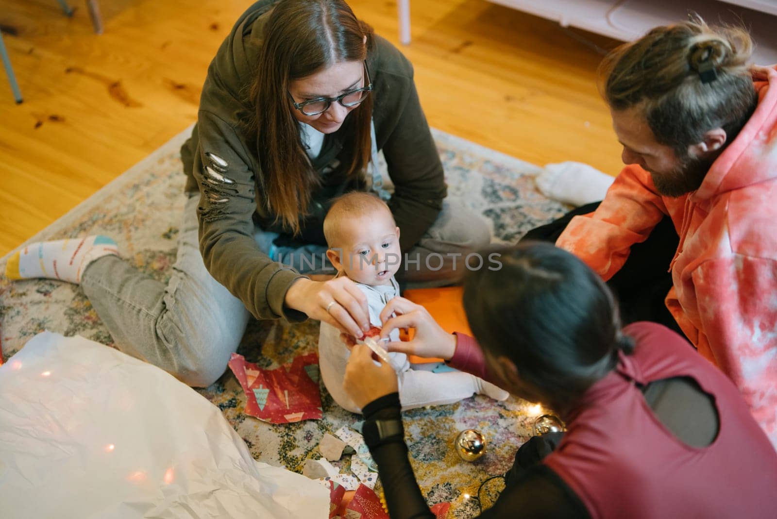 A heartwarming and joyful scene showcasing family bonding and baby happiness during a lively festive celebration