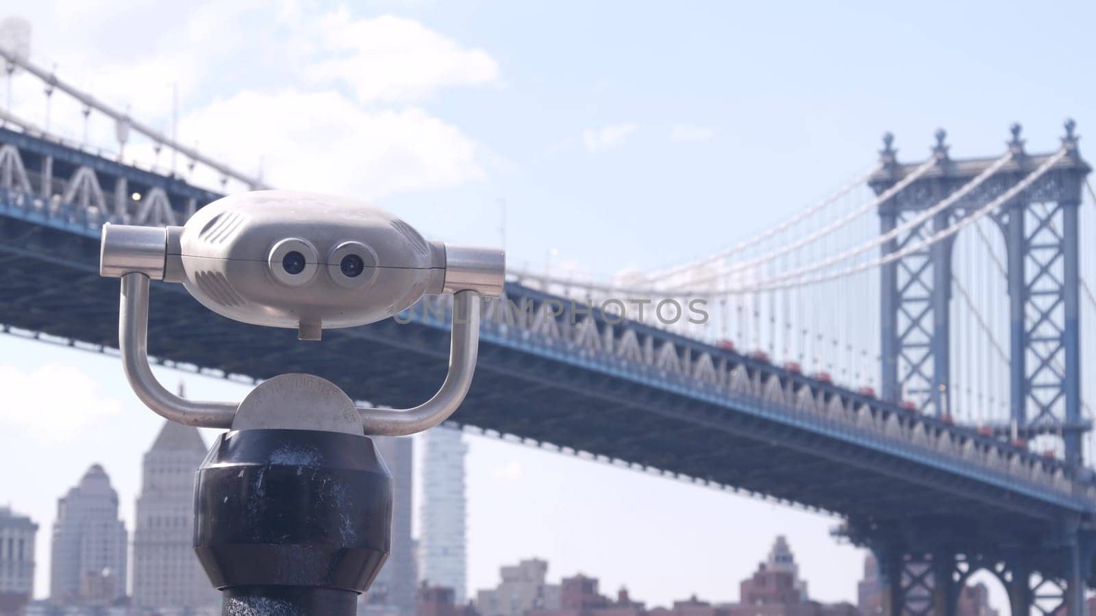 New York City, United States - 30 Aug 2023: Manhattan Bridge lookout, tower viewer binoculars, Brooklyn telescope viewpoint, Dumbo tourist landmark. East River John street park promenade. Travel USA.