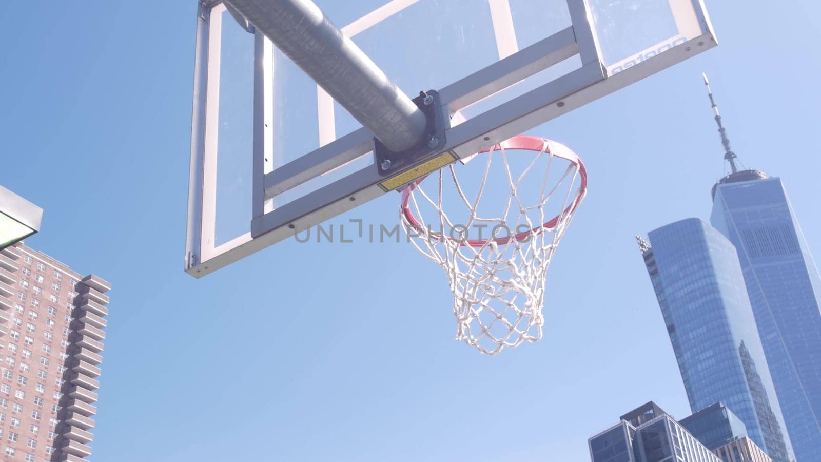 New York City, United States - 31 Aug 2023: World Trade Center, Manhattan Downtown Financial district USA. Hudson River Park basketball court. Basket ball hoop and blackboard. Outdoor streetball sport