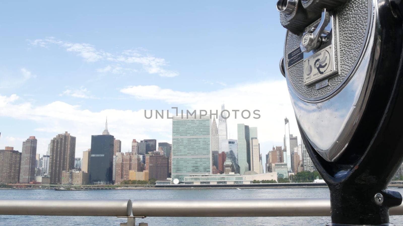 New York City, United States - 4 Sept 2023: Waterfront skyline, Manhattan Midtown, United Nations UN building riverfront skyscraper. Waterside cityscape, tower viewer, Long Island Gantry Plaza, Queens