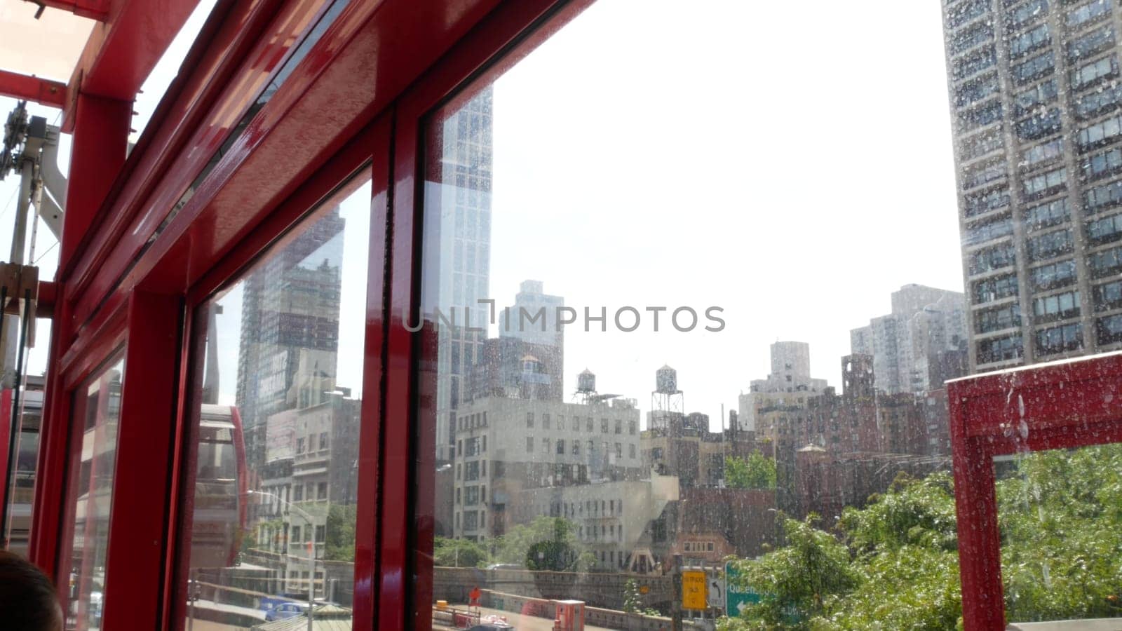 New York City, United States - 4 Sept 2023: Roosevelt Island tramway to Manhattan Midtown streets. American cable tram, Queensboro Bridge. Urban public transport, USA. Building architecture cityscape.