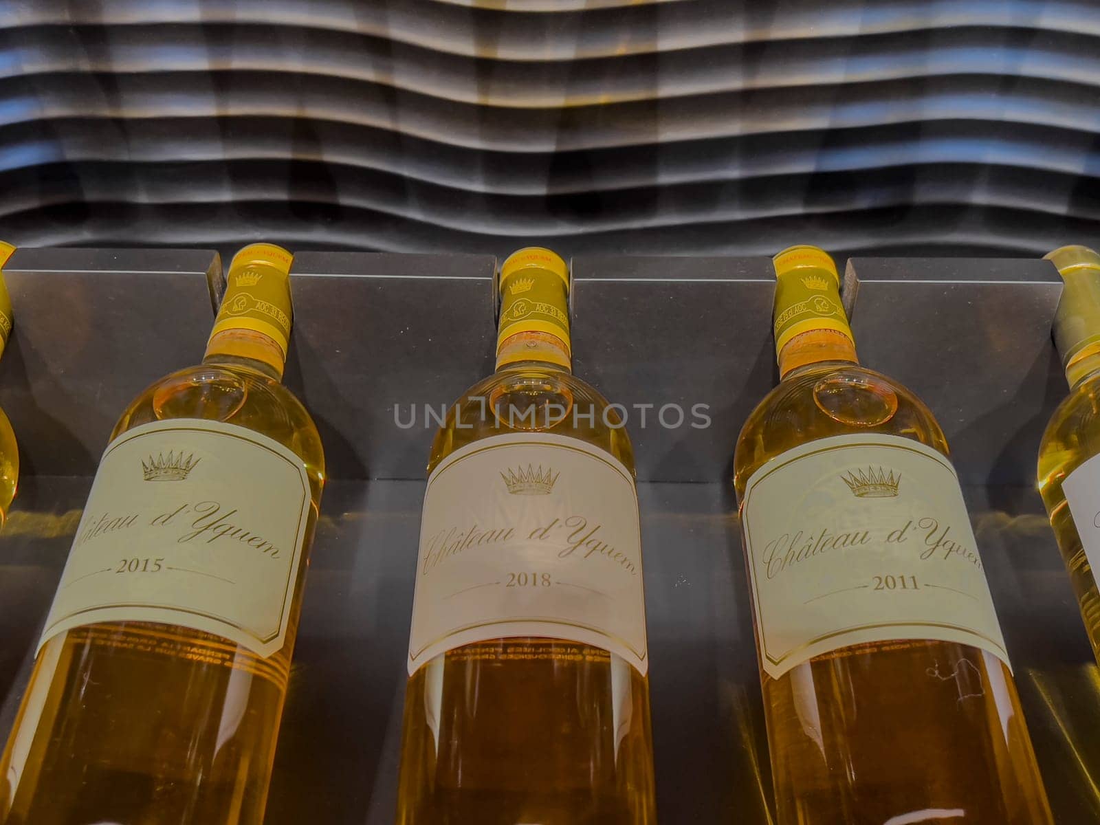 Two bottles of 2018 Sauternes wine are elegantly presented, highlighting the rich color and luxurious design that signifies a high-quality vintage selection.