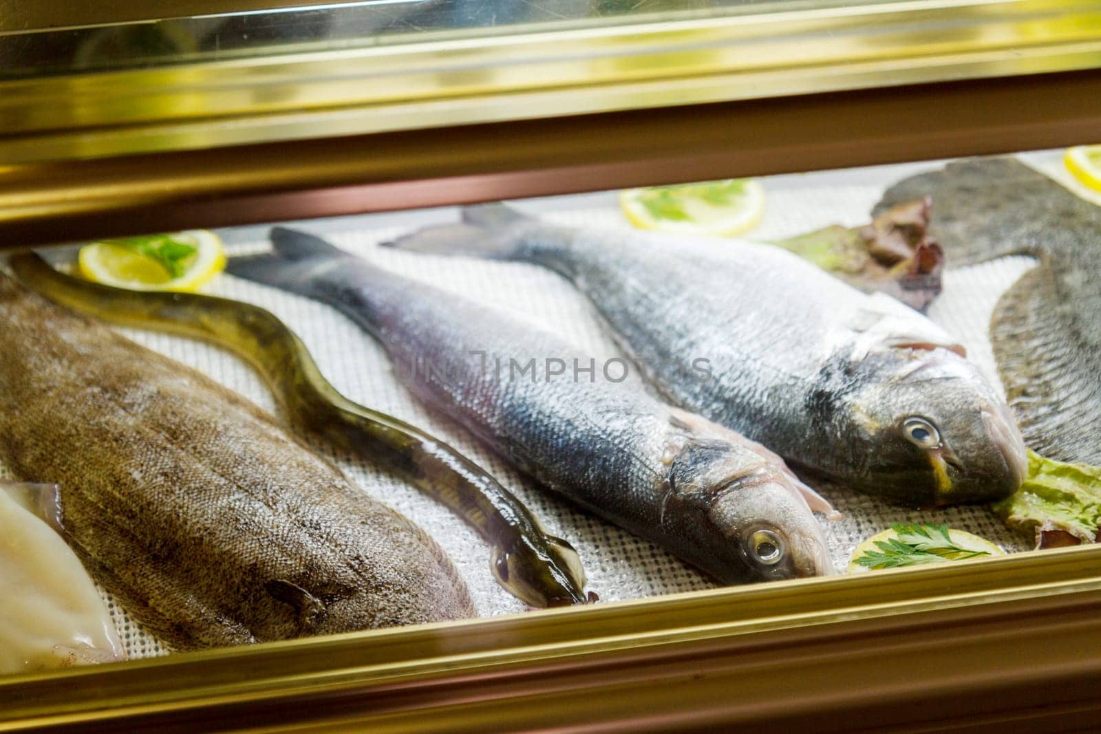 sea fish lies on the counter, food