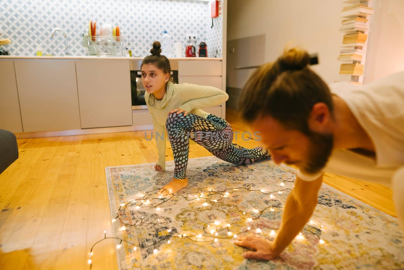 A cheerful family enjoys a fun workout at home, filled with laughter and creativity, fostering connection