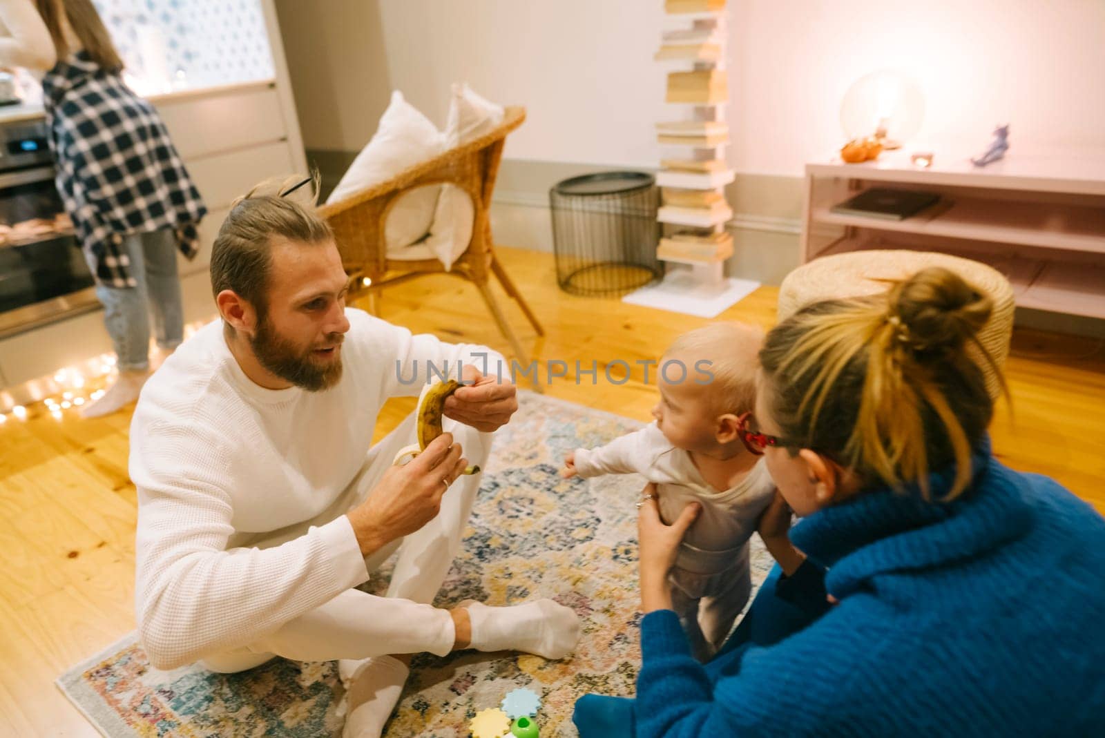An incredibly heartwarming scene depicting a family joyfully spending quality time together in a cozy setting