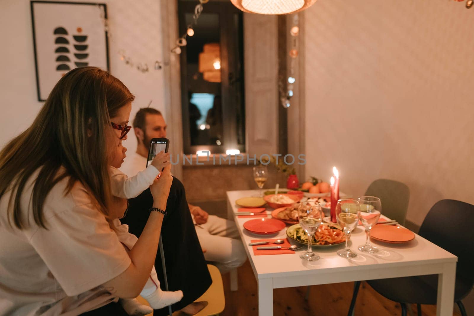 A warm and inviting family dinner setting that beautifully features delicious food, cozy ambiance, and togetherness