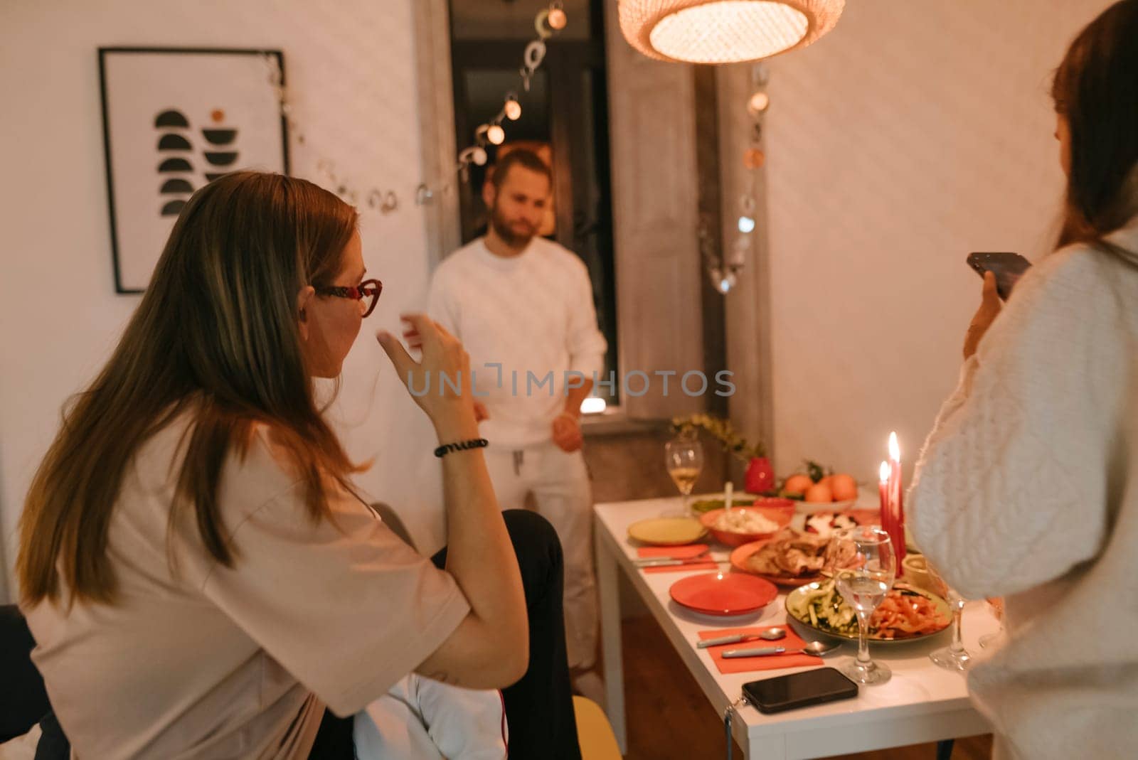 A warm dinner party with close friends, joyfully celebrating with delightful food and shared laughter